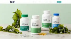 Algae-based vegan omega-3 supplement bottles and capsules arranged with fresh green algae and seaweed on a natural wellness background